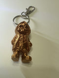 Copper colored skeleton in a hoodie keychain with purse clip