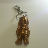 Copper colored skeleton in a hoodie keychain with purse clip