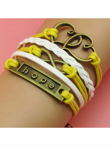 Yellow Leather charm bracelet with bronze colored charms, hope, double heart, and infinity