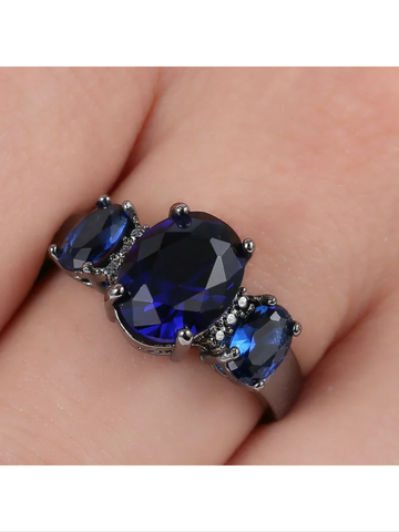 Black ring with blue CZ princess cut stone size 6.5