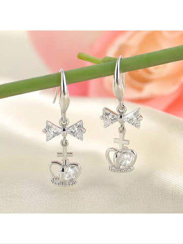Silver plated bow and cross and crown earrings