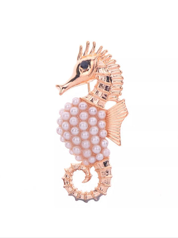 Seahorse brooch.
