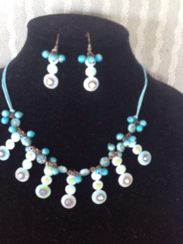 Teal beaded bib style necklace with matching earrings