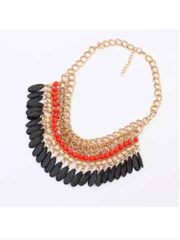 Beaded bib style necklace in Orange, brown, and black