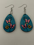 Teal blue butterfly and flower earrings