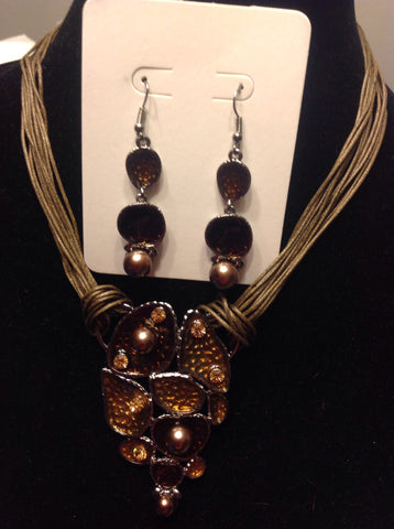 Brown multi strand leaf pendant necklace with earrings.