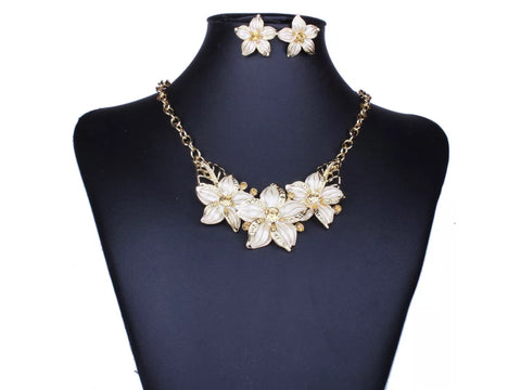 White gem beige pendant flower necklace and earrings.
