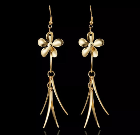 Gold tone flower dangle earrings