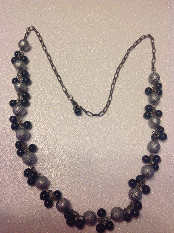 Grey and black bead necklace.