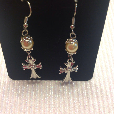 Pearl earrings with a cross charm with a flower in the center of cross