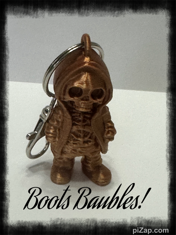 Copper colored skeleton in a hoodie keychain with purse clip