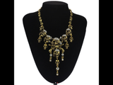 Skull and pistol rhinestone necklace.