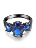 Black ring with blue CZ princess cut stone size 6.5