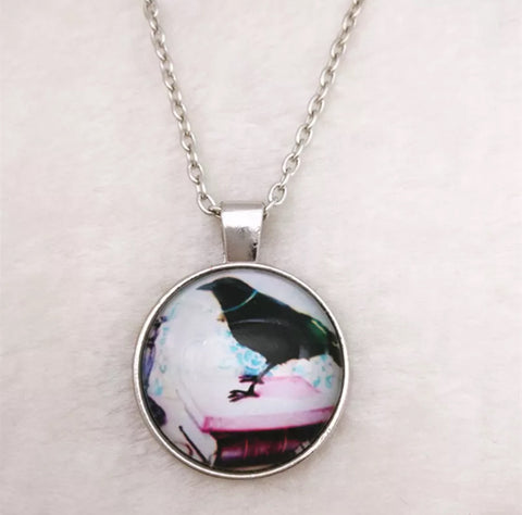 Raven and book glass cabochon necklace