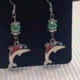 Dolphin pearl dangle earrings in silvertone