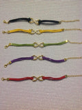 Goldtone infinity charm bracelets.