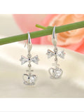 Silver plated bow and cross and crown earrings