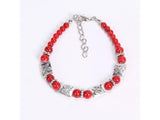 Red and silvertoned tibet butterfly bracelet.