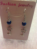 Pearl key charm earrings in silvertone