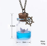 Glass bottle necklace with paper boat