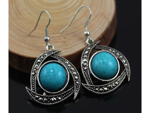 Teal and silver rhinestone earrings.