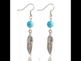 Turquoise colored Feather earrings