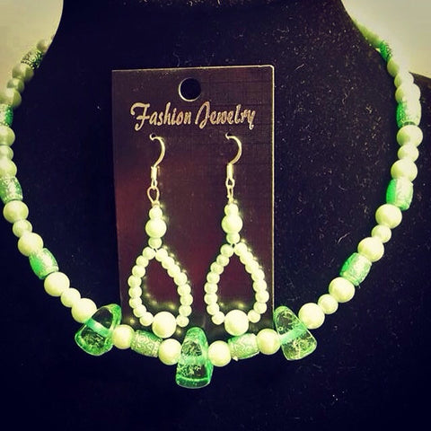 Pastel green pearl necklace with matching earrings.