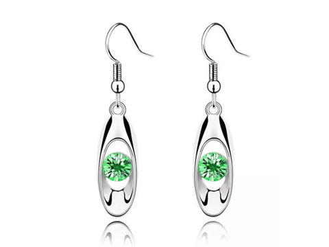 Green cubic zirconia drop earrings.